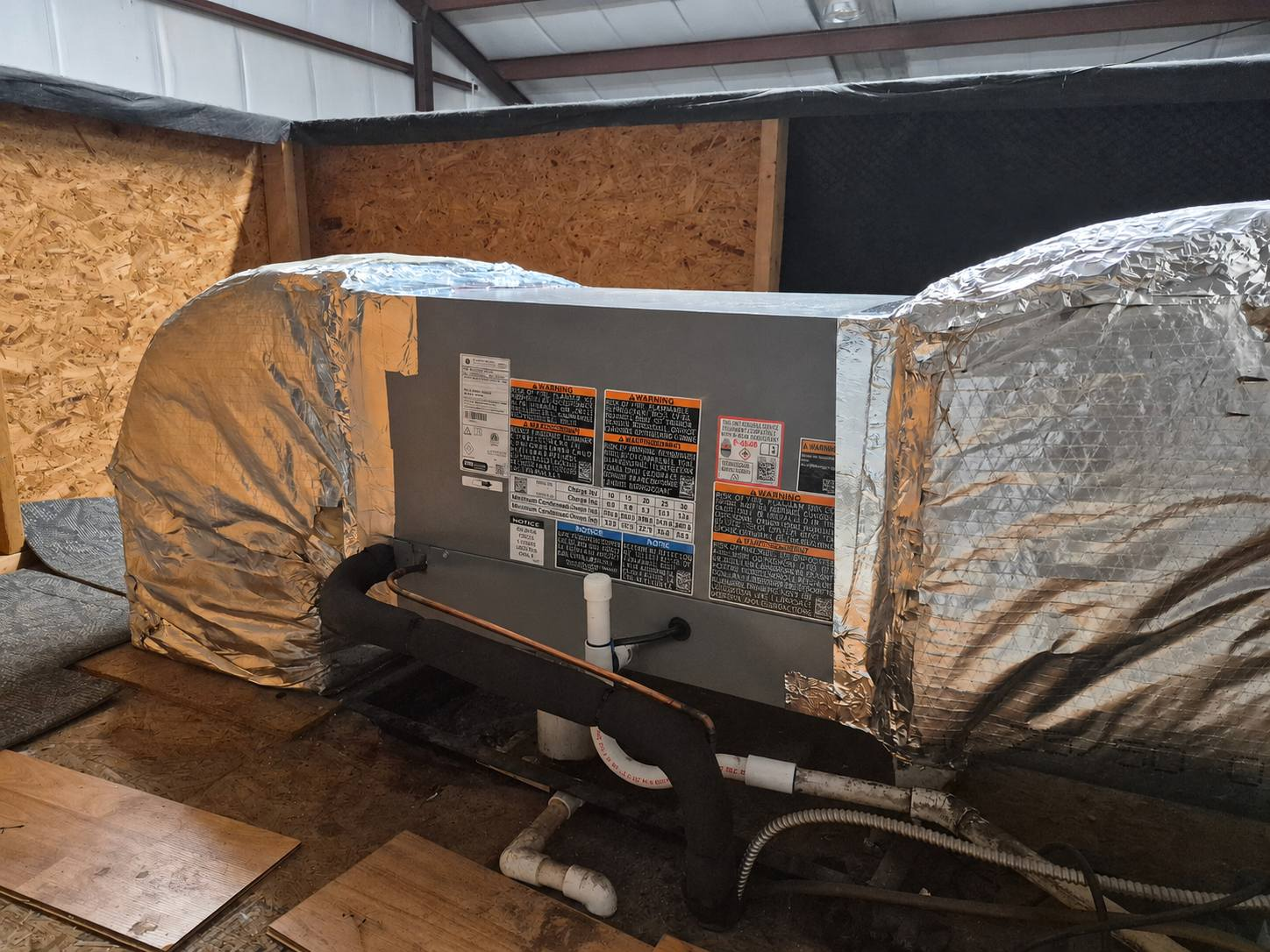 Installed air handler and insulated ductwork in attic